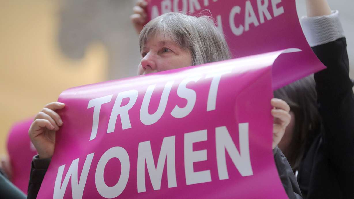 A woman holds a sign during a press conference at the Capitol in Salt Lake City on Wednesday, April 10, 2019, where the Planned Parenthood Association of Utah announced a lawsuit filed by the ACLU of Utah over a newly passed law that bans abortions beginning at 18 weeks of pregnancy. (Photo: Kristin Murphy, Deseret News)
