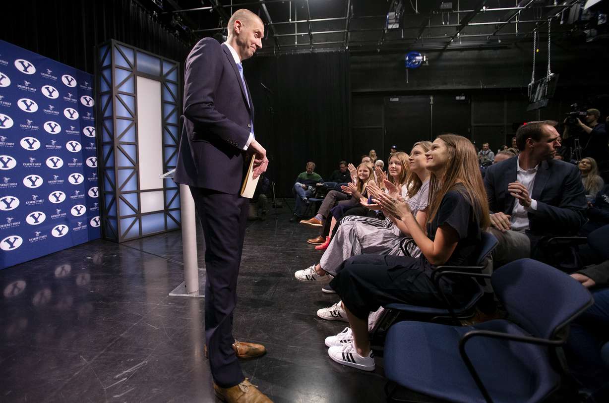 As he finishes his press conference, BYU's new men's basketball head coach Mark Pope looks at his family as he takes his seat at the BYU Broadcast Building in Provo on Wednesday, April 10, 2019. (Photo: Scott G Winterton, KSL)