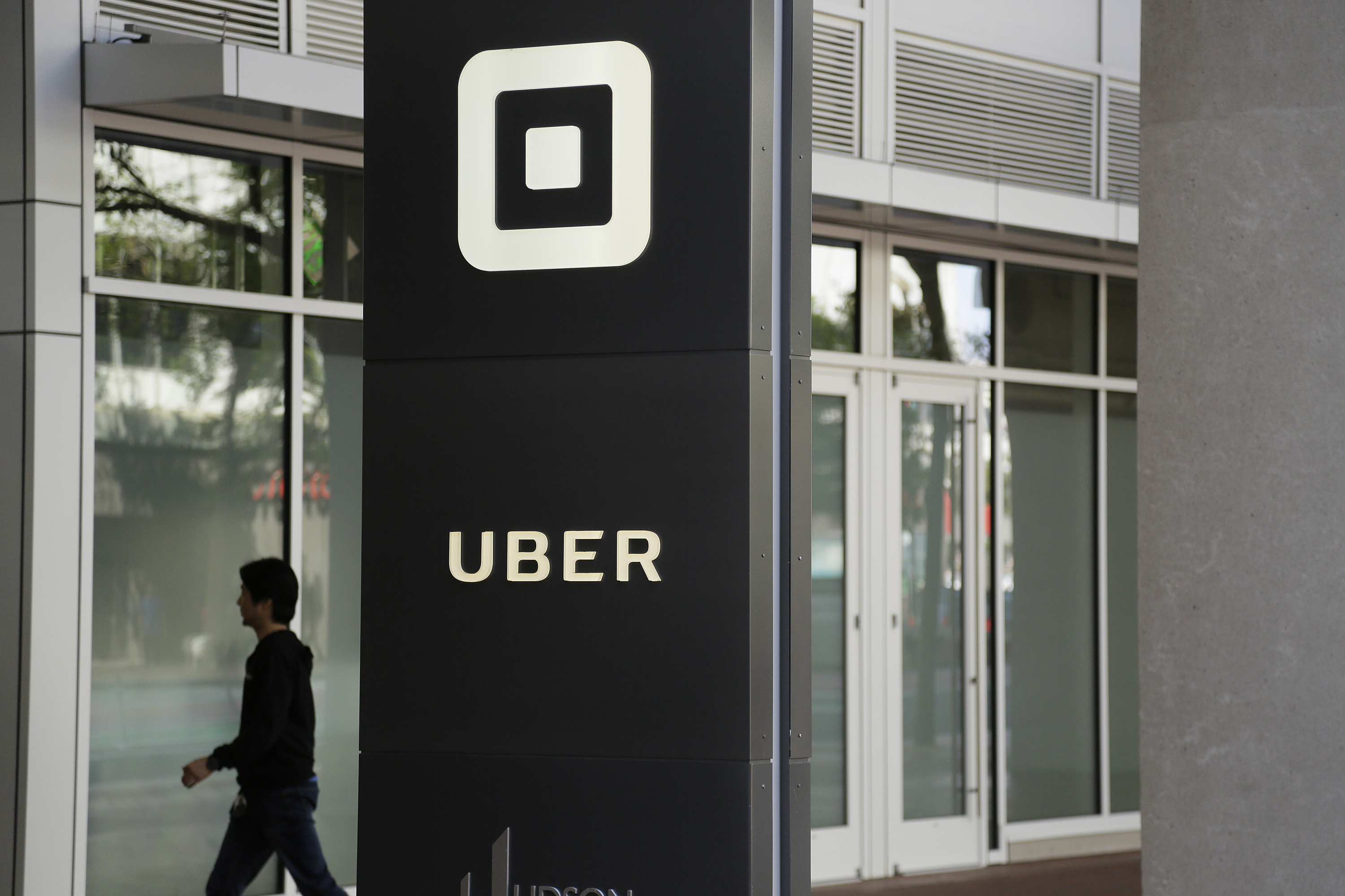 The Latest: Uber navigating criminal probes on road to IPO