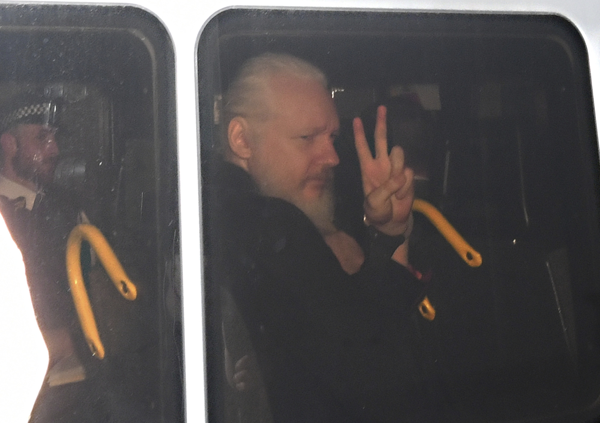 The Latest: WikiLeaks editor says Assange in a London prison
