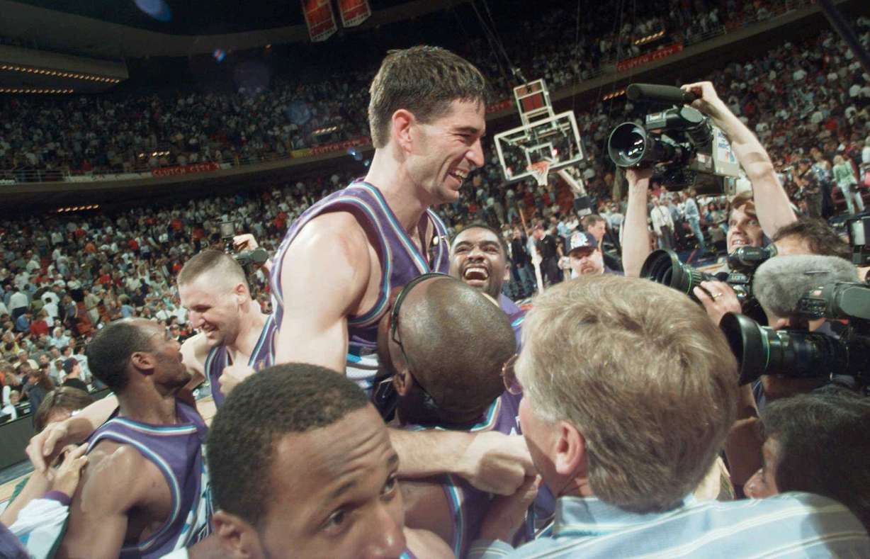 Utah Jazz's John Stockton is lifted on the shoulders of his teammates after sinking a three-point shot at the buzzer to beat the Houston Rockets 103-100 in Game 6 of the Western Conference Finals Thursday, May 29, 1997, in Houston. The Jazz will advance to play the Chicago Bulls in The NBA Finals. (AP Photo/Pat Sullivan)