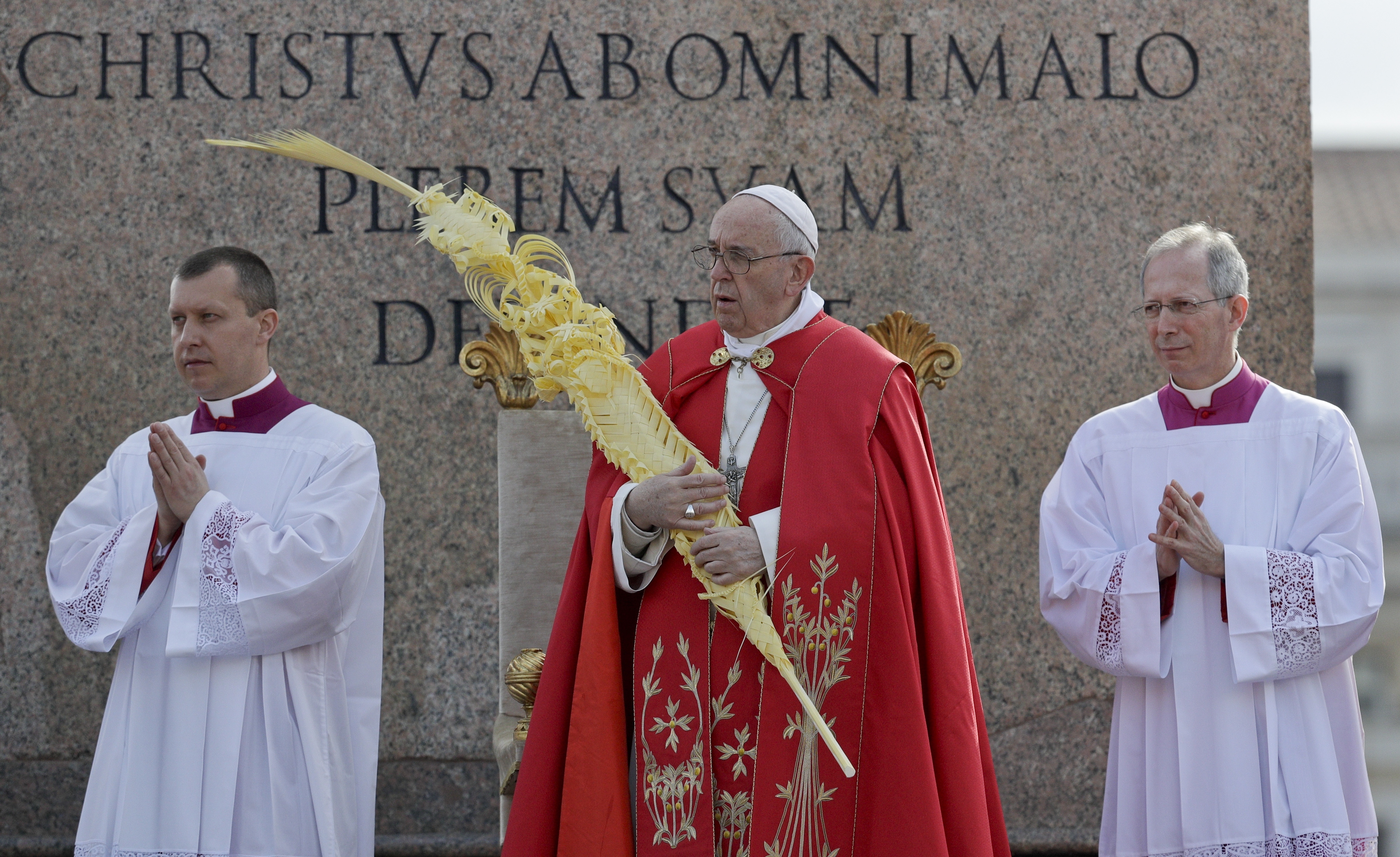 Pope Francis blesses palm branches as he ushers in Holy Week