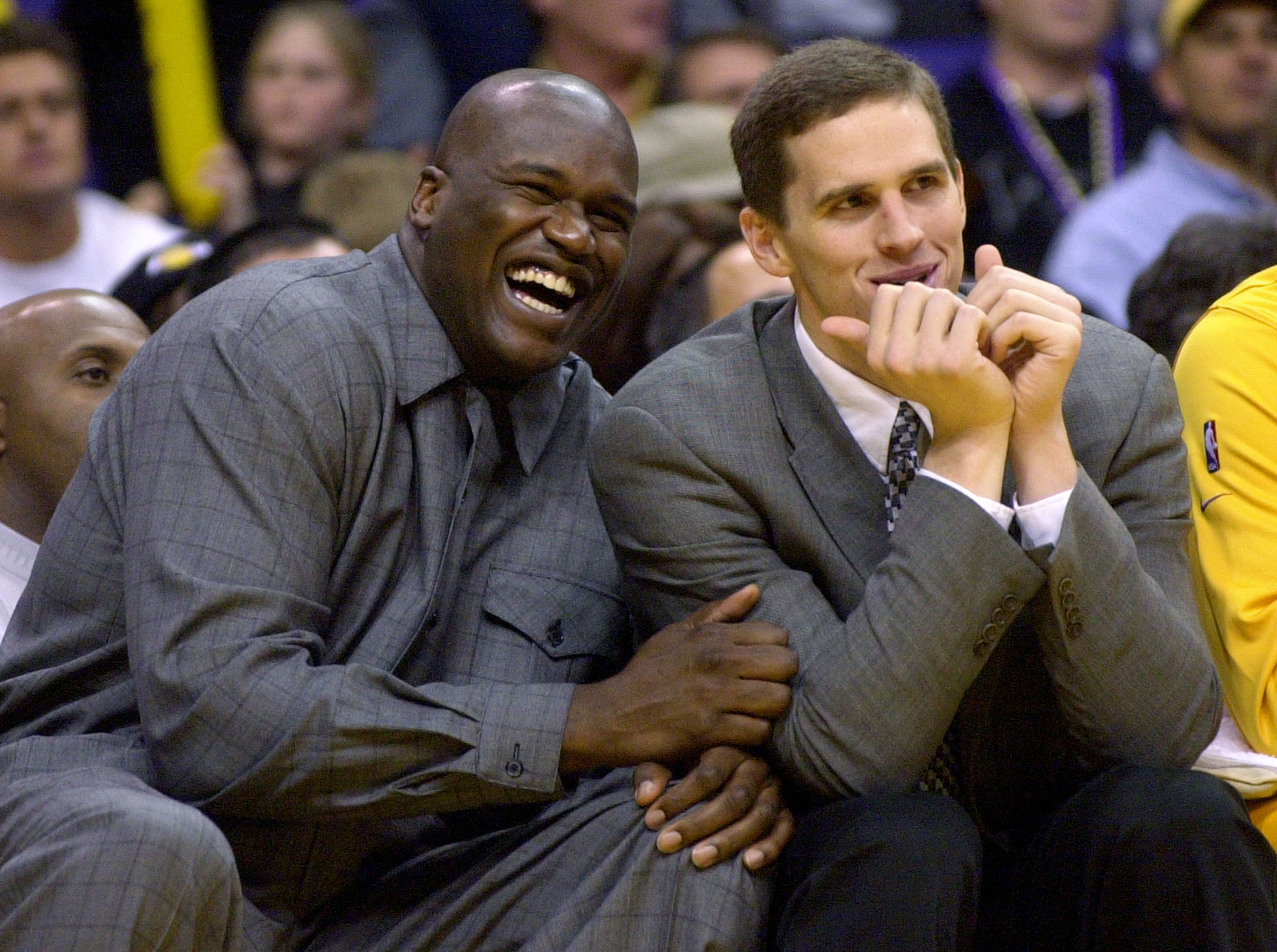 Los Angeles Lakers Shaquille O'Neal, left, and Mark Madsen laugh as they joke around from the bench during the third quarter of the game against the Portland Trail Blazers Sunday, Nov. 3, 2002, in Los Angeles. (Photo: Kevork Djansezian, AP)