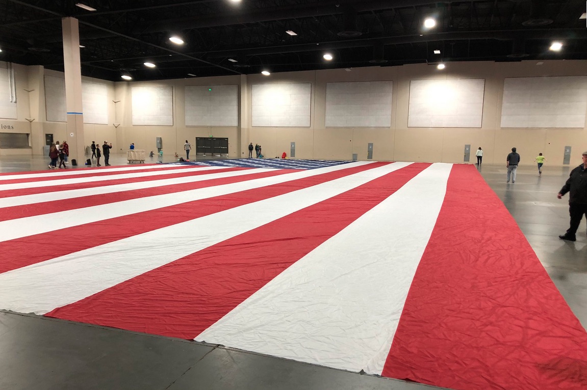 An American flag was unveiled to Major Brent Taylor's family at the Mountain America Expo Center in Sandy on April 16, 2019. The giant American flag that belongs to the Major Brent Taylor Foundation was stolen this weekend in North Ogden.