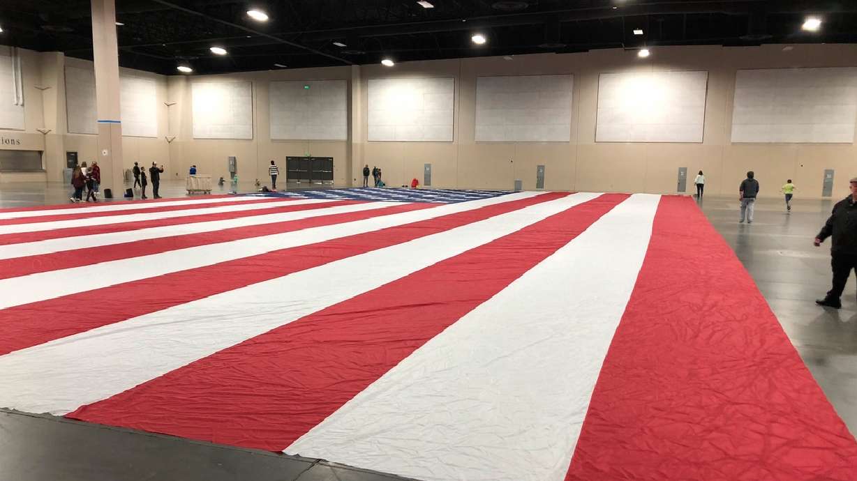 An American flag was unveiled to Major Brent Taylor's family at the Mountain America Expo Center in Sandy on April 16, 2019. The giant American flag that belongs to the Major Brent Taylor Foundation was stolen this weekend in North Ogden.