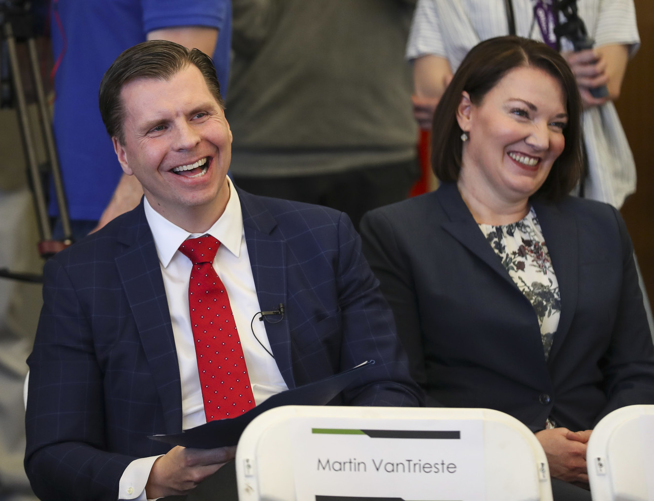 Dan Liljenquist, chairman of Civica Rx, and Erin Fox, senior director of drug information services at the University of Utah, laugh as Martin VanTrieste, president and CEO of Civica Rx, speaks during a ribbon-cutting ceremony at the company's headquarters in Lehi on Thursday, April 18, 2019. Civica Rx is a revolutionary national nonprofit drug company that will help patients across the nation by making generic medications accessible and affordable. (Photo: Steve Griffin, KSL)