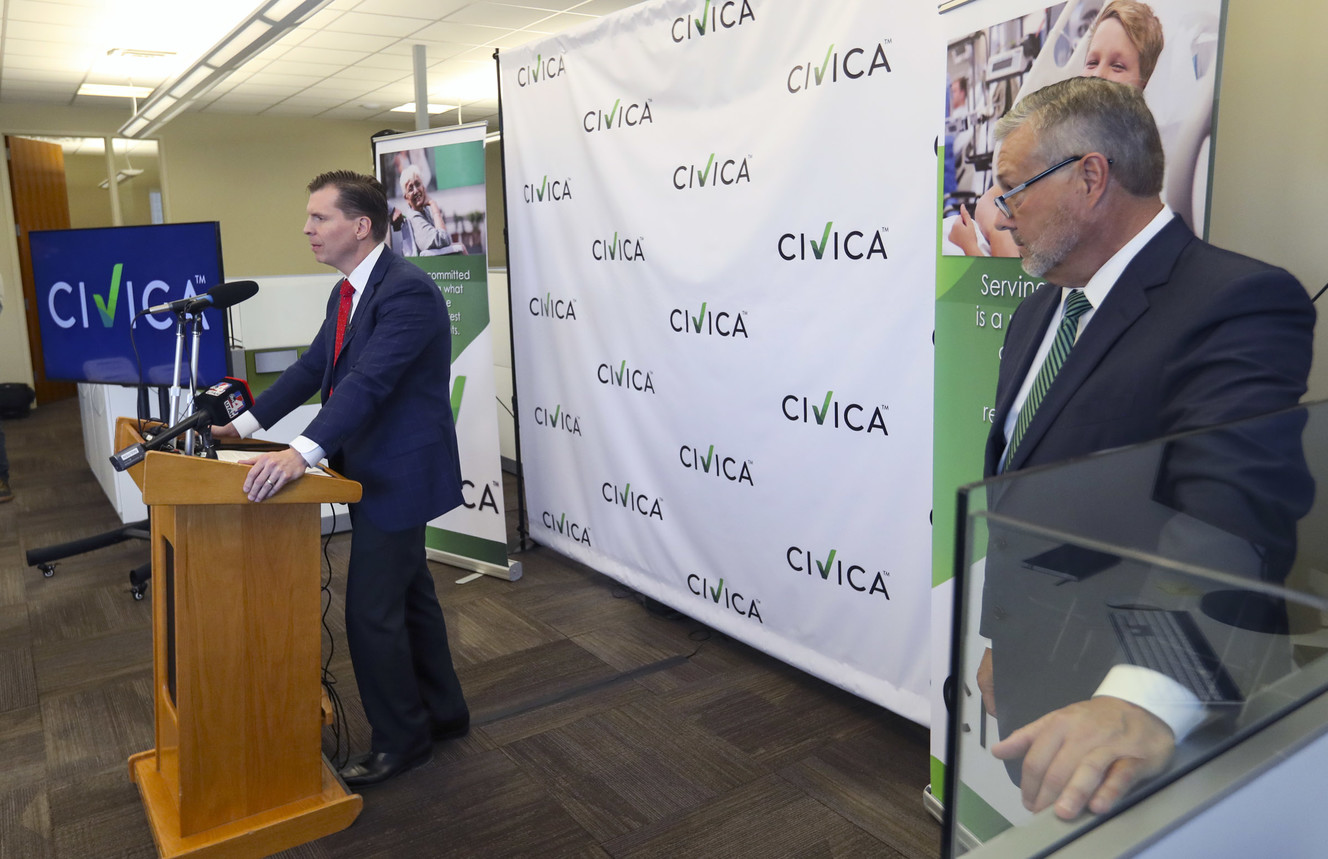 Martin VanTrieste, president and CEO of Civica Rx, listens to Dan Liljenquist, chairman of Civica Rx, as he speaks during a ribbon-cutting ceremony at the company’s headquarters in Lehi on Thursday, April 18, 2019. Civica Rx is a revolutionary national nonprofit drug company that will help patients across the nation by making generic medications accessible and affordable. (Photo: Steve Griffin, KSL)