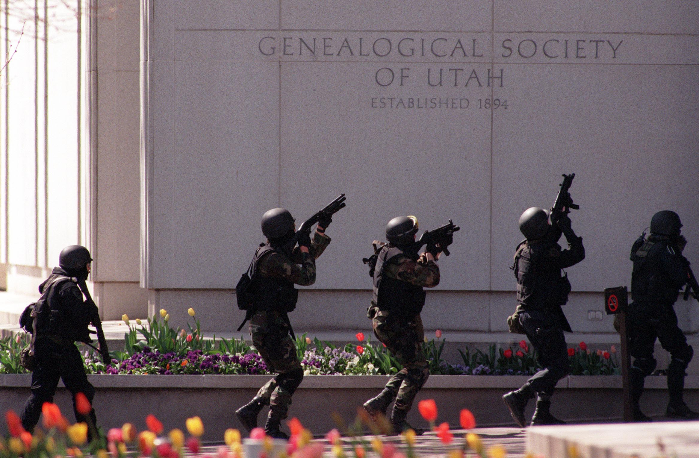 A SWAT team enters the LDS Church Family History Library in downtown Salt Lake City after a shooter began firing on Thursday, April 15, 1999. Three people, including the shooter were killed, and another three were injured in the shooting. (Photo: Kristan Jacobsen, Deseret News, File)