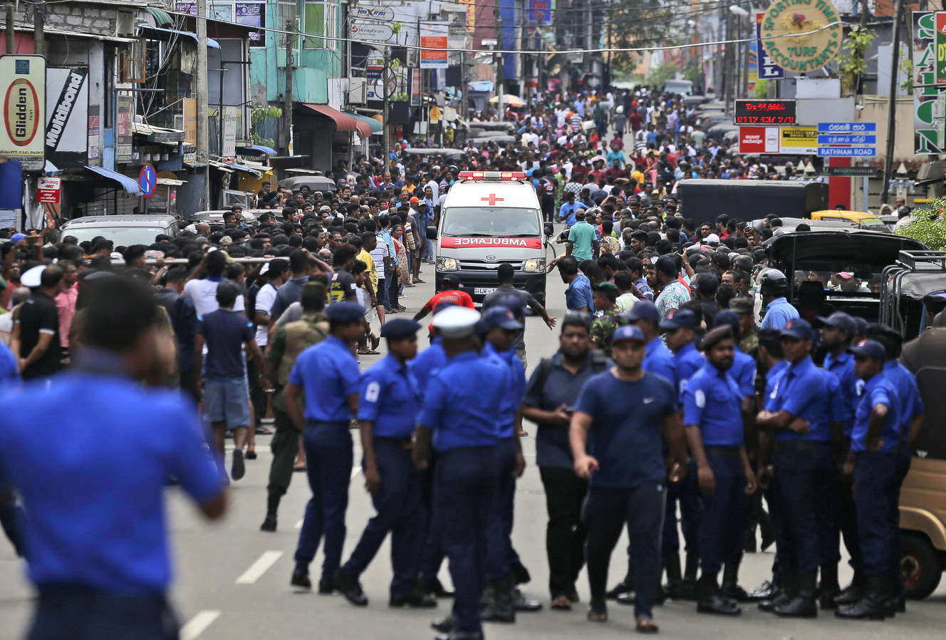 Sri Lankan police officers clear the road as an ambulance drives through carrying those injured in church blasts in Colombo, Sri Lanka, Sunday, April 21, 2019. More than 200 people were killed and hundreds more wounded in nine bombings that rocked churches, luxury hotels and other sites in Sri Lanka. (Photo: Eranga Jayawardena, AP)