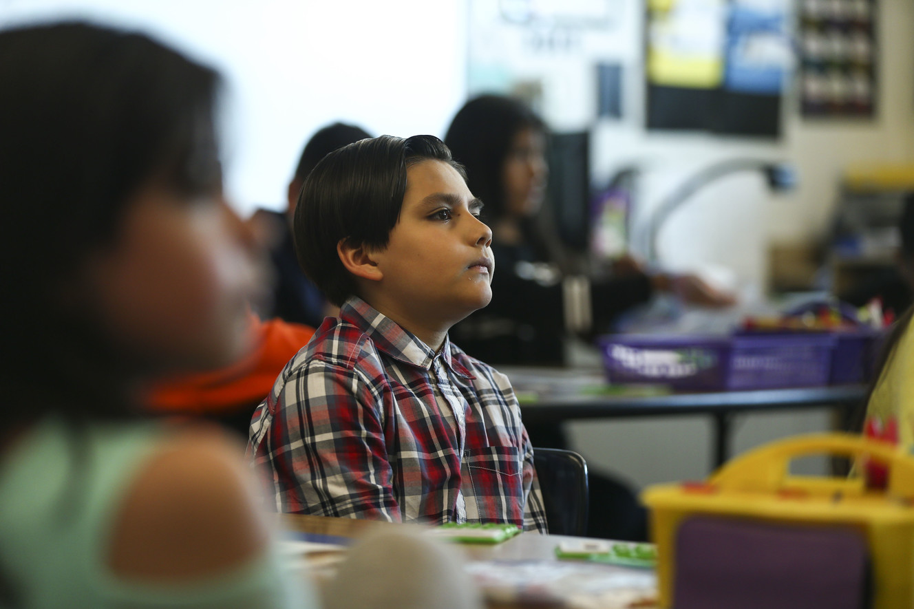Fourth-grader Isayah Ojea listens to Rep. Ben McAdams, D-Utah, speak to his class as a part of National Teach Children to Save Day at Granger Elementary School in West Valley City on Monday, April 22, 2019. McAdams serves on the Financial Services Committee and co-chairs the Blue Dog Coalition Task Force on Fiscal Responsibility and Government Reform. (Photo: Silas Walker, KSL)