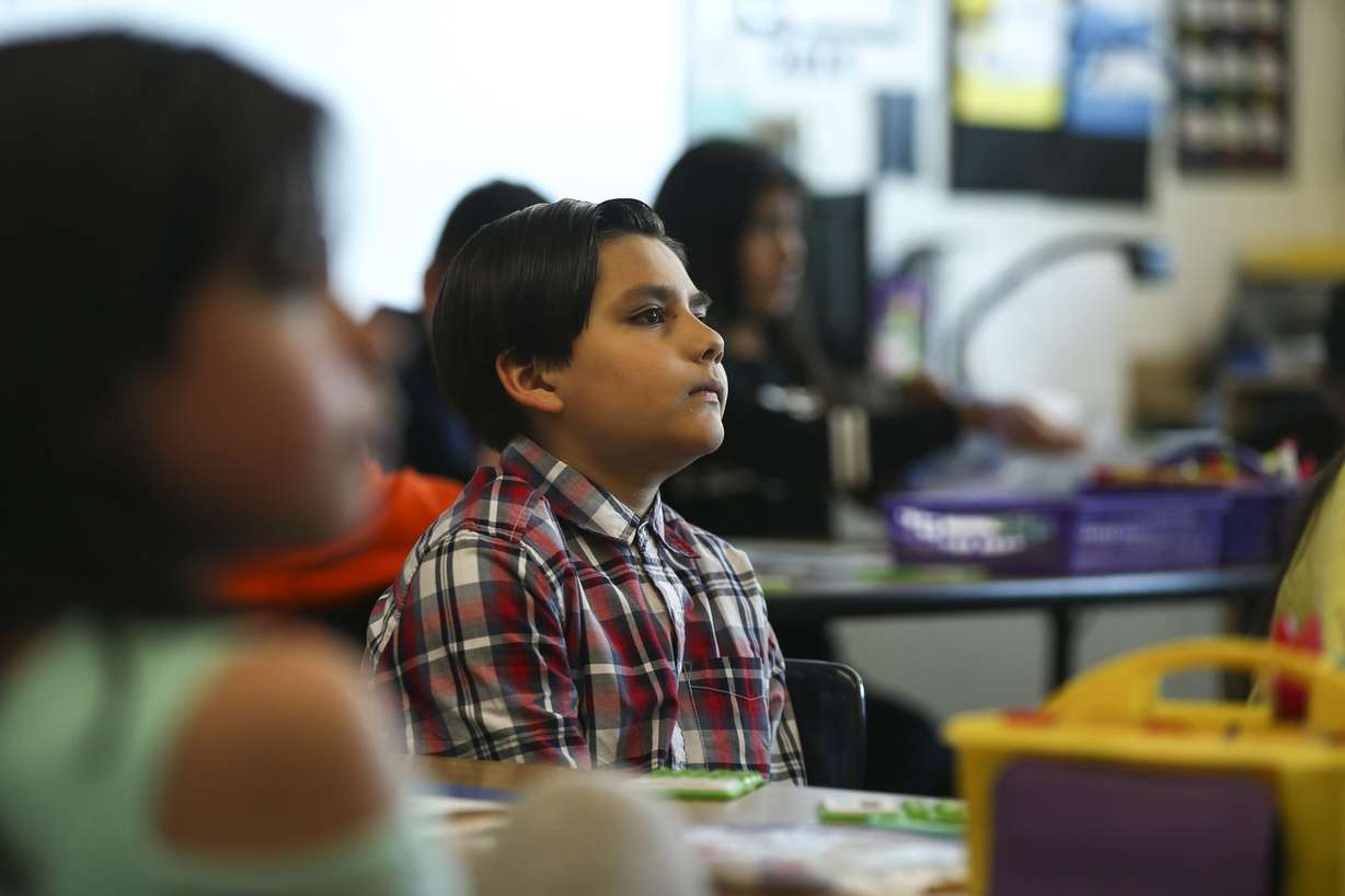 Fourth-grader Isayah Ojea listens to Rep. Ben McAdams, D-Utah, speak to his class as a part of National Teach Children to Save Day at Granger Elementary School in West Valley City on Monday, April 22, 2019. McAdams serves on the Financial Services Committee and co-chairs the Blue Dog Coalition Task Force on Fiscal Responsibility and Government Reform. (Photo: Silas Walker, KSL)