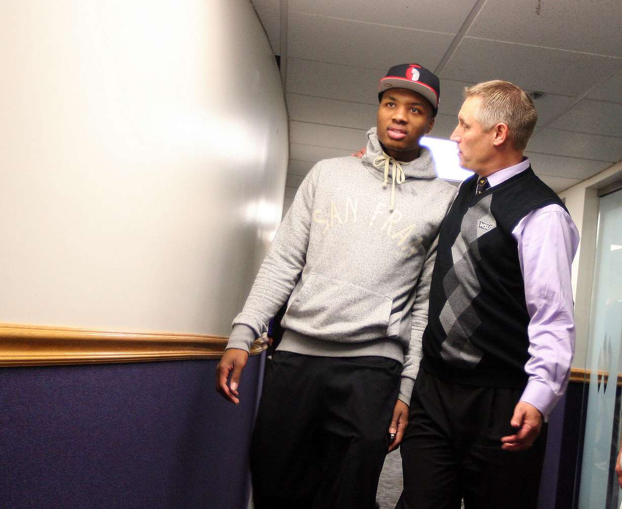 Former Weber State basketball star Damian Lillard, currently with the Portland Trailblazers, talks with WSU athletic directorJerry Bovee prior to the Purple and White scrimmage game at the Dee Events Center in Ogden Wednesday, Oct. 23, 2012. (Photo: Brian Nicholson, Deseret News)