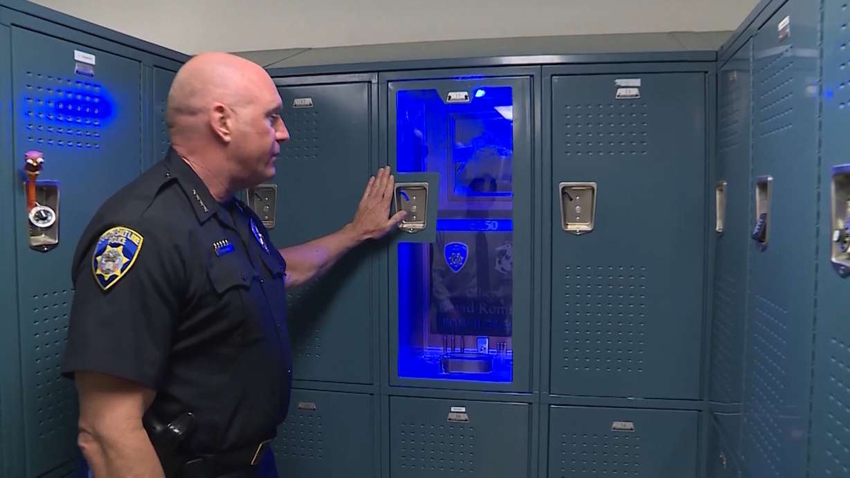 South Salt Lake Police Chief Jack Carruth shows a locker memorial for fallen officer David Romrell in South Salt Lake on April 24, 2019. (Photo: Stuart Johnson, KSL TV)