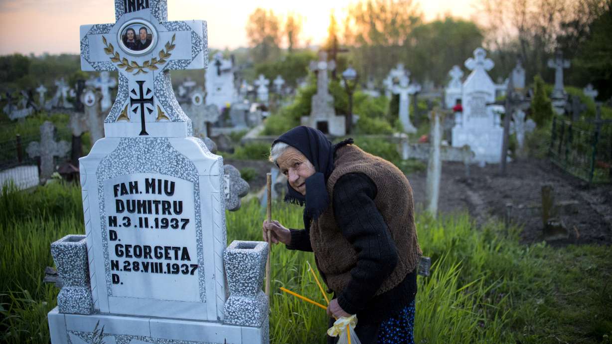Romanian villagers light graveyard fires in Easter ritual