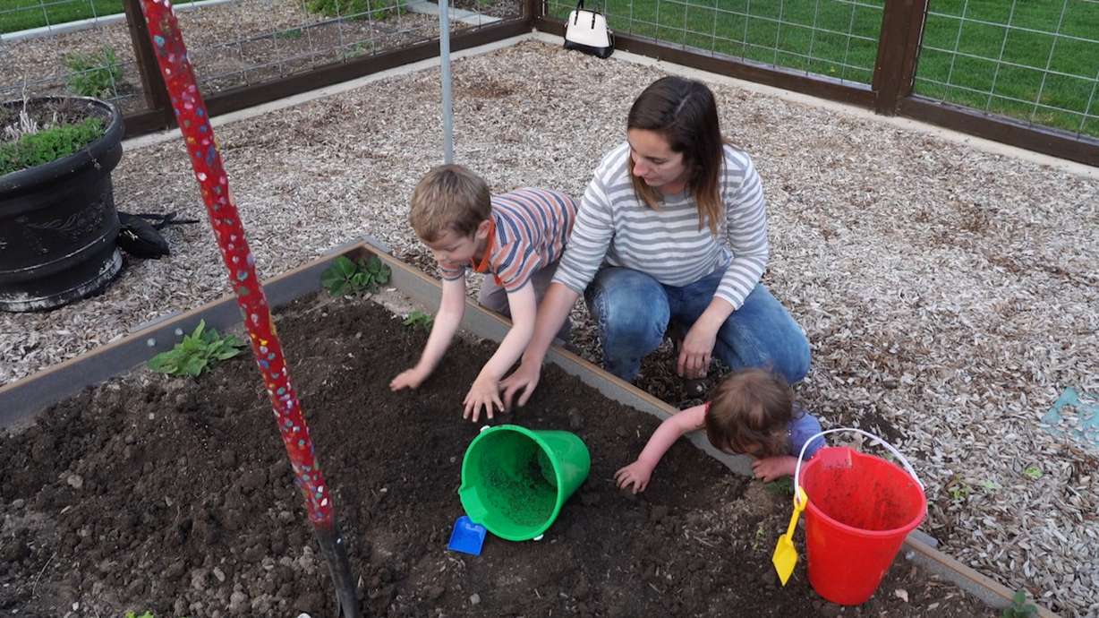 Katie Foerster prepares the soil for their garden plot at the Orem Community Hospital's LiVe Well Garden. (Photo: KSL TV)