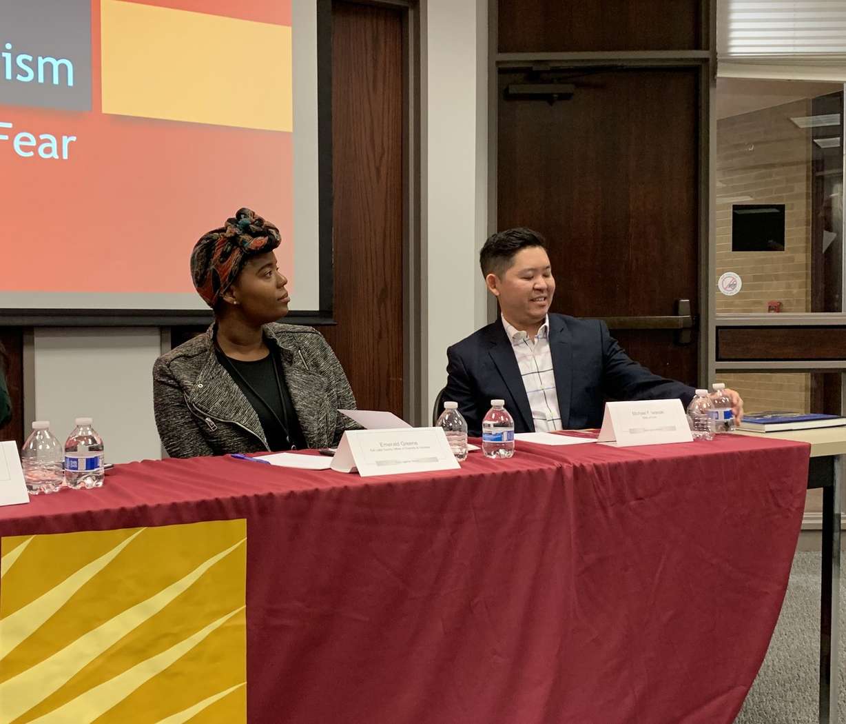 Panelists Emerald Greene and Michael F. Iwasaki listen to comments during a Stand Against Racism — No Hate-No Fear panel discussion at the Salt Lake County Government Complex in Salt Lake City on Friday April 26, 2019. (Photo: Lauren Bennett, KSL)