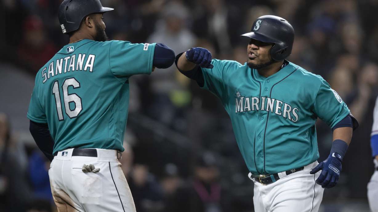 Encarnacion has 4 RBIs, Mariners beat Rangers 5-4 in 11