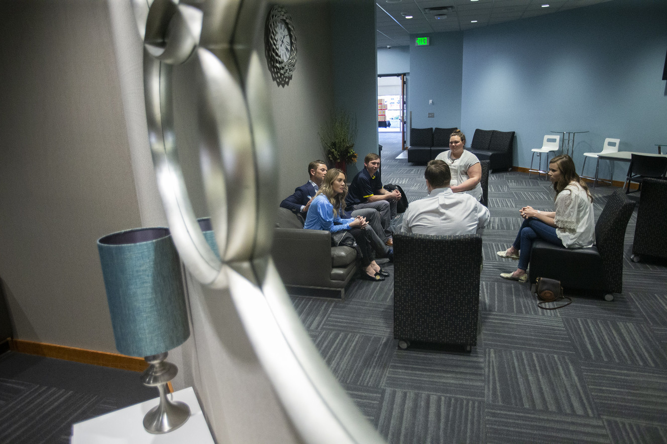 Some of Gail Miller's grandchildren and their spouses discuss charitable giving during a meeting in Sandy on Thursday, April 25, 2019. In 2016, the family matriarch launched an effort to get the generation whom she calls Miller 3.0 to become involved in the Larry H. & Gail Miller Family Foundation. (Photo: Scott G Winterton, KSL)