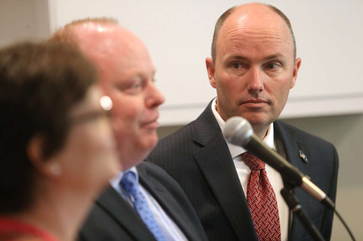 Utah Lt. Gov. Spencer Cox listens as Housing and Community Development Division Director Jonathan Hardy speaks to media about an initiative to get 100 once-homeless people into housing as part of the transition from closing the Road Home shelter in downtown Salt Lake City and the opening of three new, smaller homeless resource centers. Housing Connect CEO Janice Kimball is in foreground during a news conference at Sharon Gardens Apartments in South Salt Lake on Monday, April 29, 2019. (Photo: Scott G Winterton, KSL)