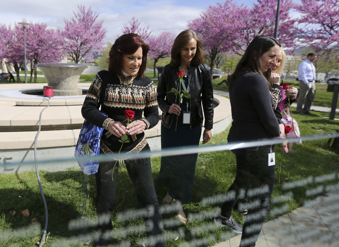 Alice Walsh, left, searches for the name of her son, Connor, on the Celebration of Life Donor Monument at Library Square in Salt Lake City on Tuesday, April 30, 2019, after a press conference where those personally impacted by tissue donation shared their stories. Connor, who died at 23, chose to be an eye, organ and tissue donor. (Photo: Kristin Murphy, KSL)