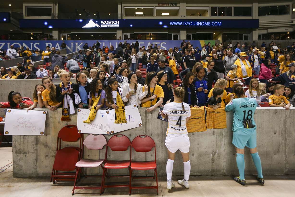 Utah Royals FC defender Becky Sauerbrunn (4) and Utah Royals FC goalkeeper Nicole Barnhart (18) sign jerseys for fans after they beat the Washington Spirit 1-0 at Rio Tinto Stadium in Sandy on Saturday, April 20, 2019. (Photo: Silas Walker, Deseret News)