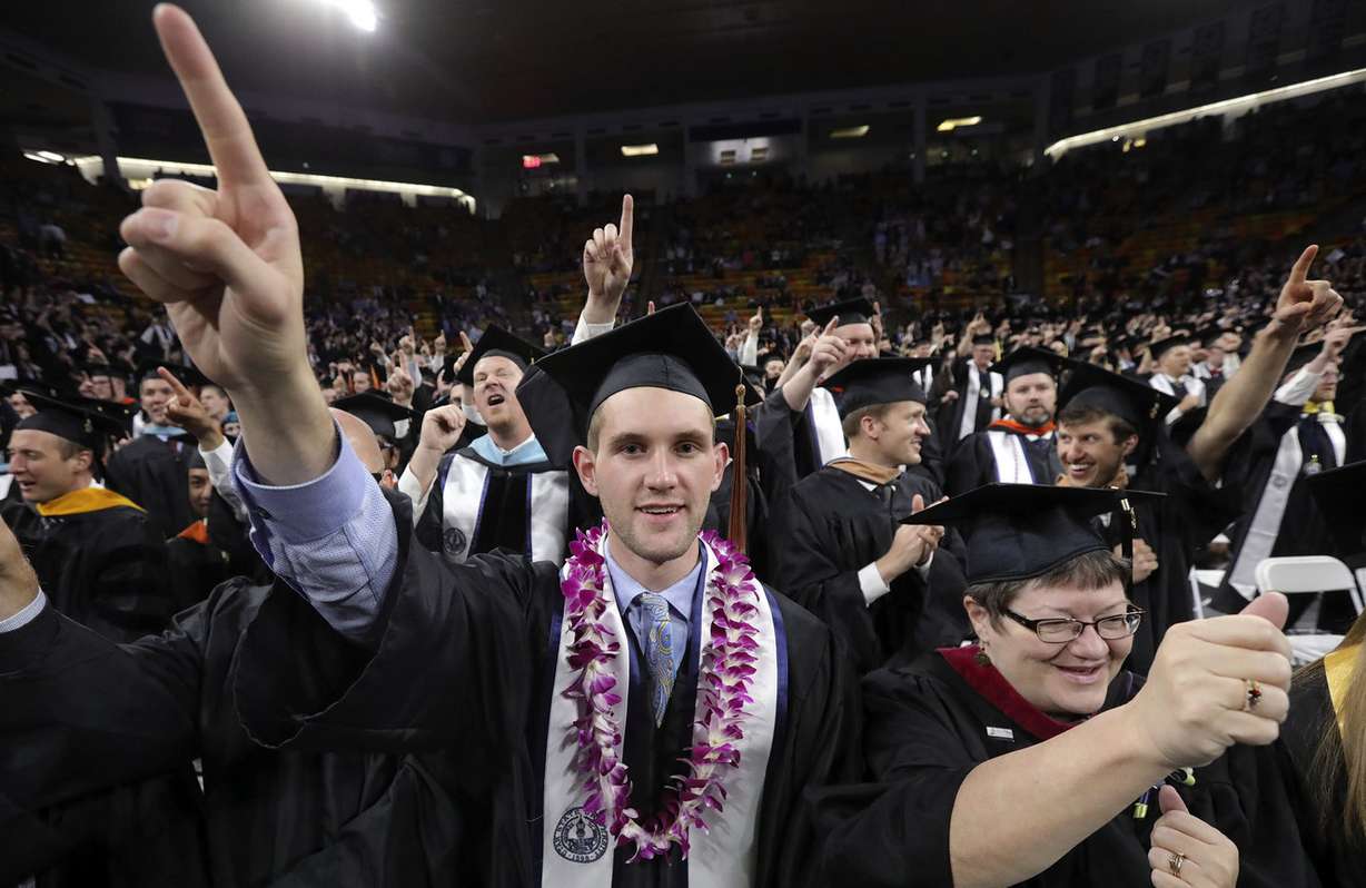 Jake Wilcox chants The Scotsman with other recent graduates during Utah State University's commencement ceremony at the Dee Glen Smith Spectrum in Logan on Thursday, May 2, 2019. (Photo: Kristin Murphy, KSL)