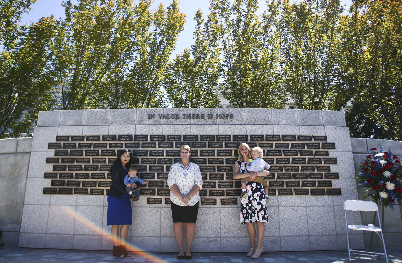 Family members of three fallen Utah officers pose for a photo in front of the Law Enforcement Memorial at the Capitol in Salt Lake City on Thursday, May 2, 2019. (Photo: Silas Walker, KSL)
