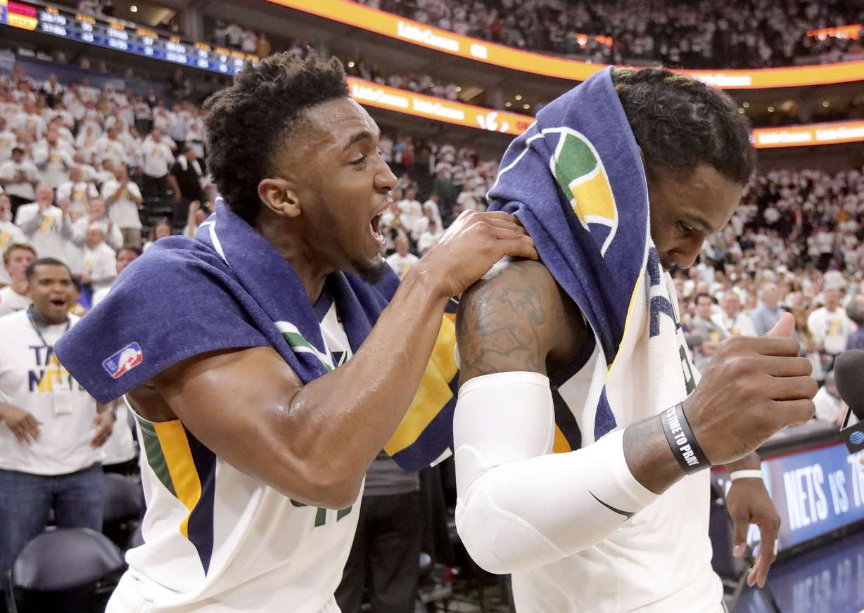 Utah Jazz guard Donovan Mitchell (45) grabs Utah Jazz forward Jae Crowder (99) as they celebrate winning Game 4 of the NBA Playoffs against the Houston Rockets. (Kristin Murphy, KSL)