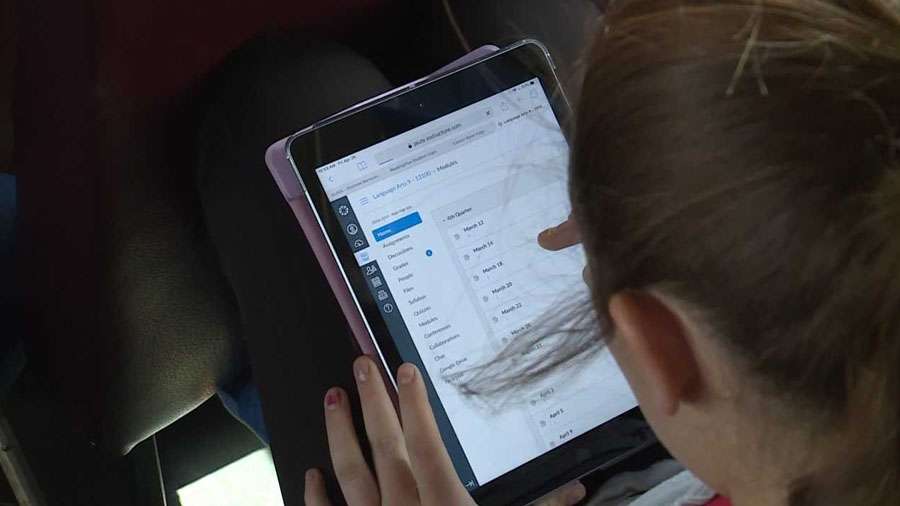 A student doing homework on the bus Thursday, May 2, 2019. Photo: John Wilson, KSL TV