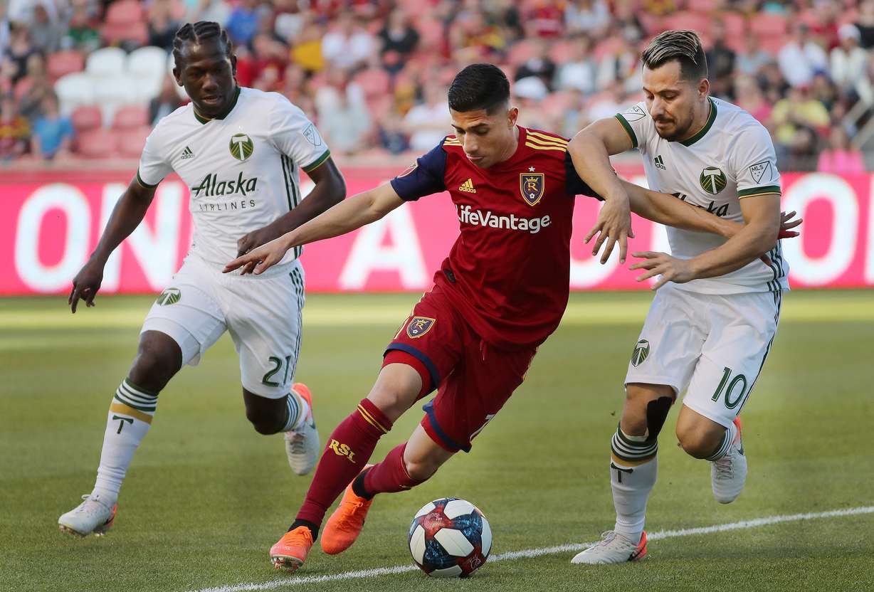 Real Salt Lake forward Jefferson Savarino (7) tries to dribble around Portland Timbers midfielder Sebastian Blanco (10) in Sandy on Saturday, May 4, 2019. (Photo: Jeffrey D. Allred, Deseret News)