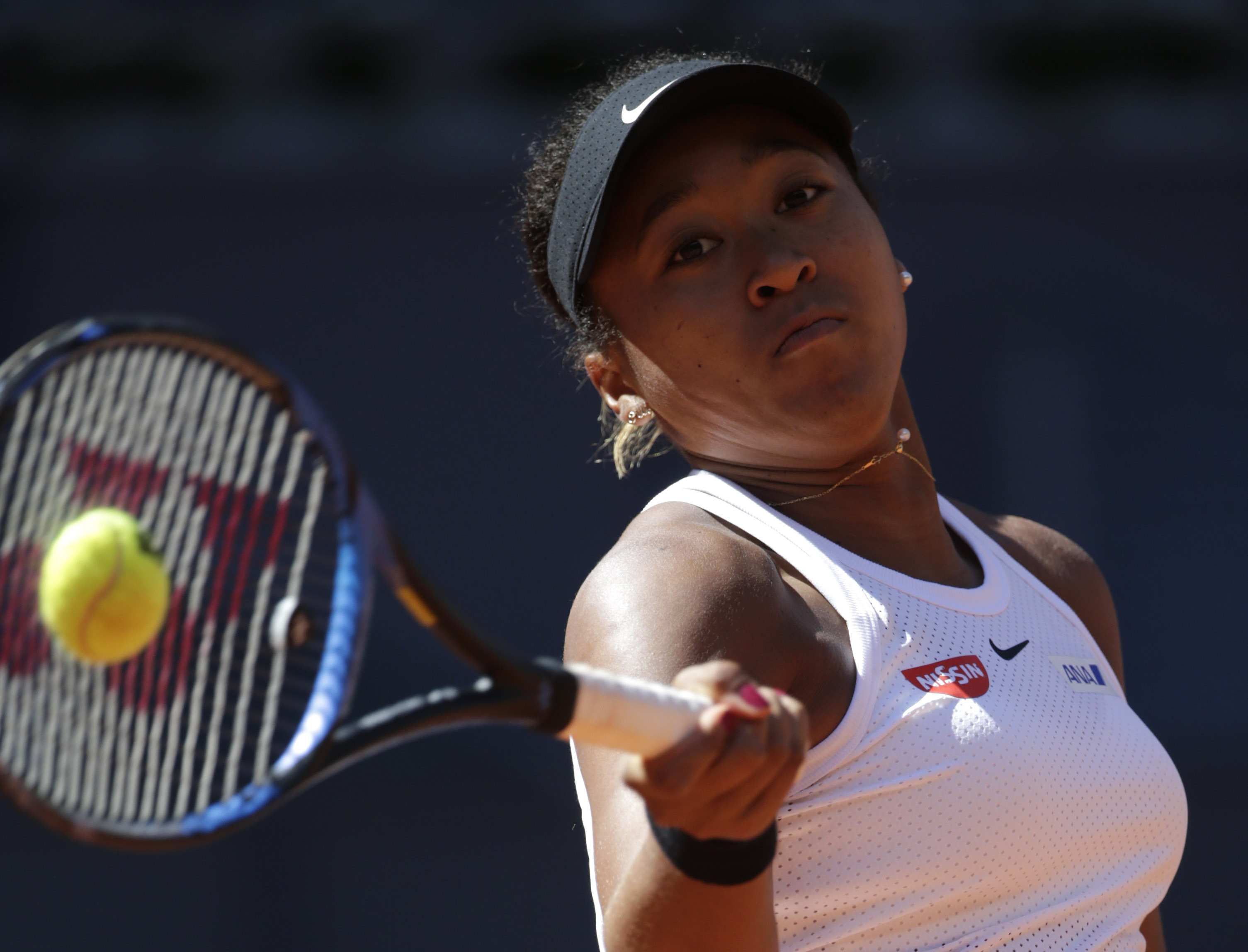 Osaka wins Madrid opener, Muguruza loses in 1st round
