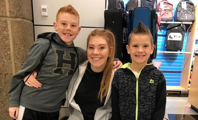Taylor Cutler (center) is pictured with her two younger brothers. (Photo: Family photo)