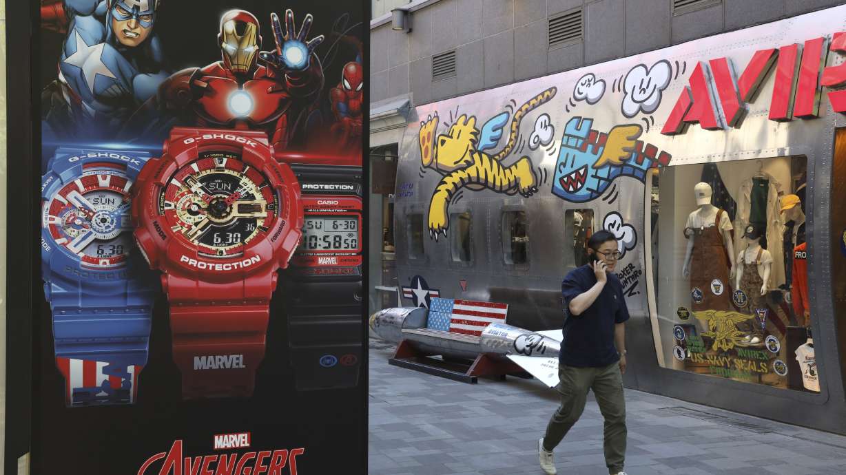 The Latest: Shares dive as Trump tweets rattle investors