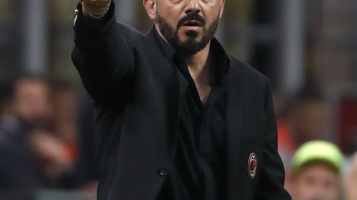 Milan beats Bologna 2-1 to keep Champions League hopes alive