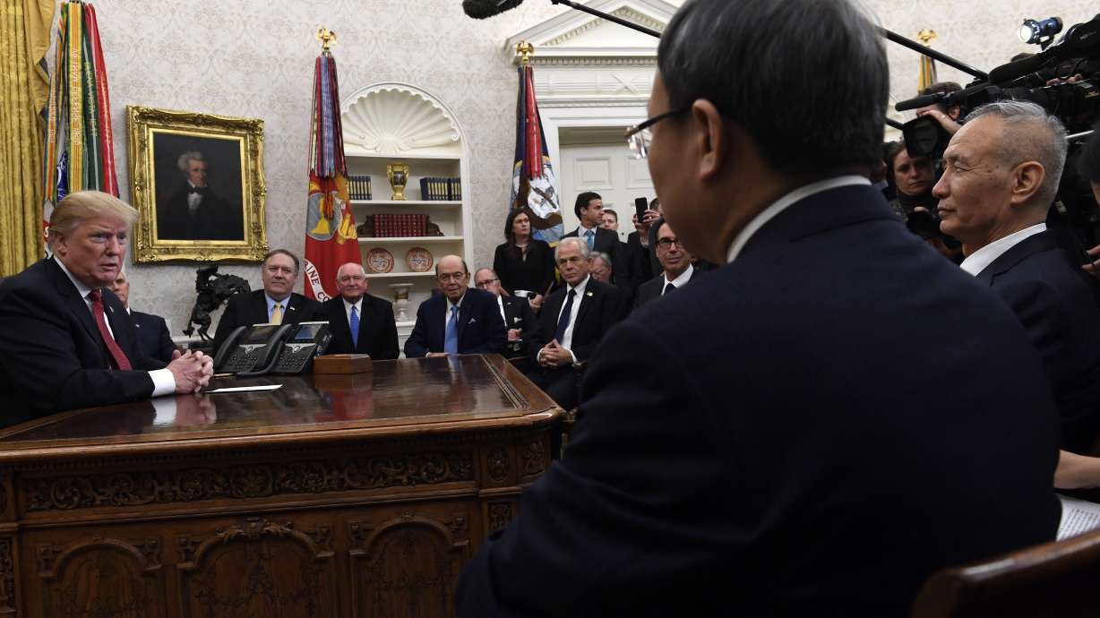 The Latest: Trade dispute escalates between US and China