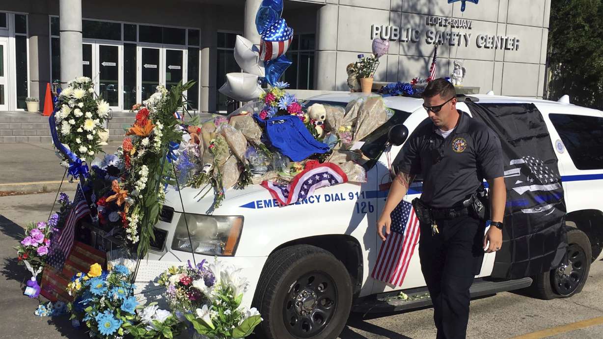 The Latest: Service honors slain Mississippi officer