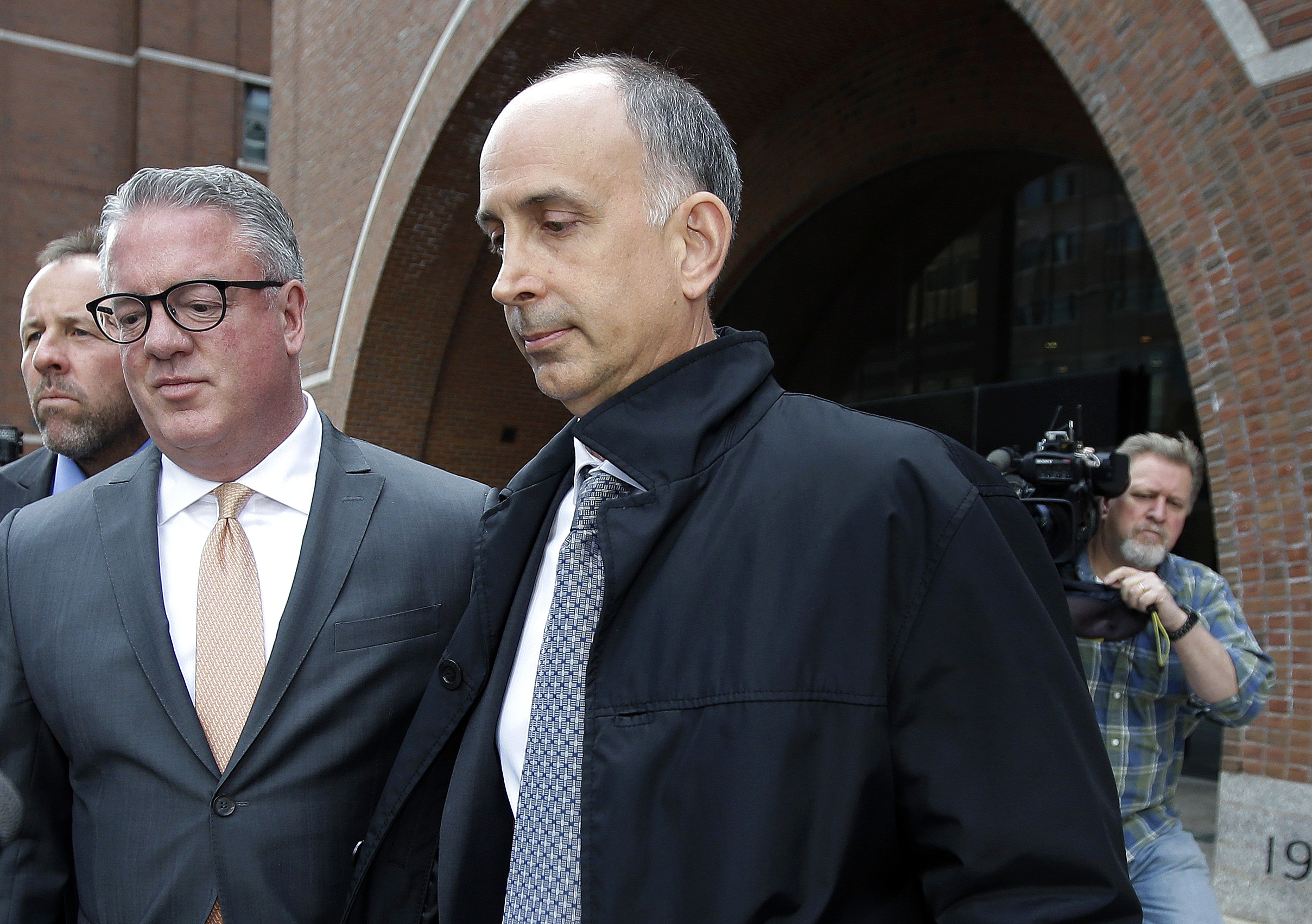 A 3rd parent pleads guilty in college admissions scheme