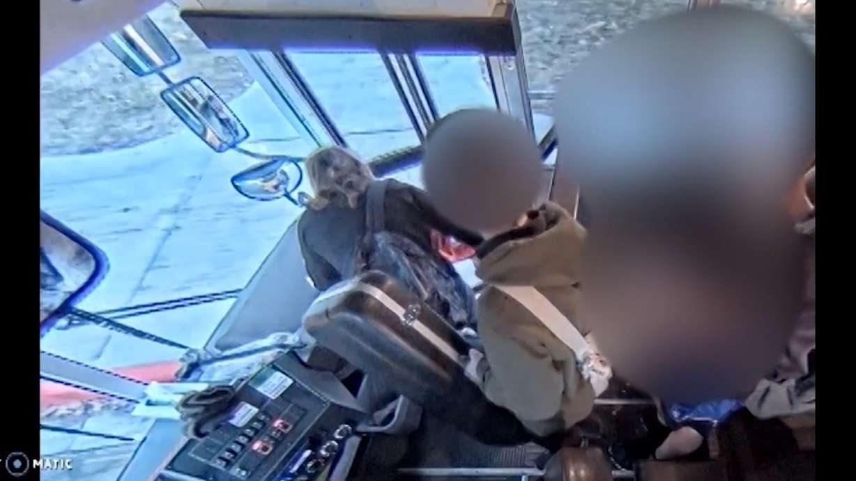 Brenda Mayes says this surveillance video from a Davis County school bus shows a Feb. 4, 2019 incident in which the bus driver allegedly closed the bus door on Mayes' son's backpack as he attempted to exit at West Point Junior High, trapping his backpack inside the bus with his body dangling outside of it. (Photo: Davis County School District)