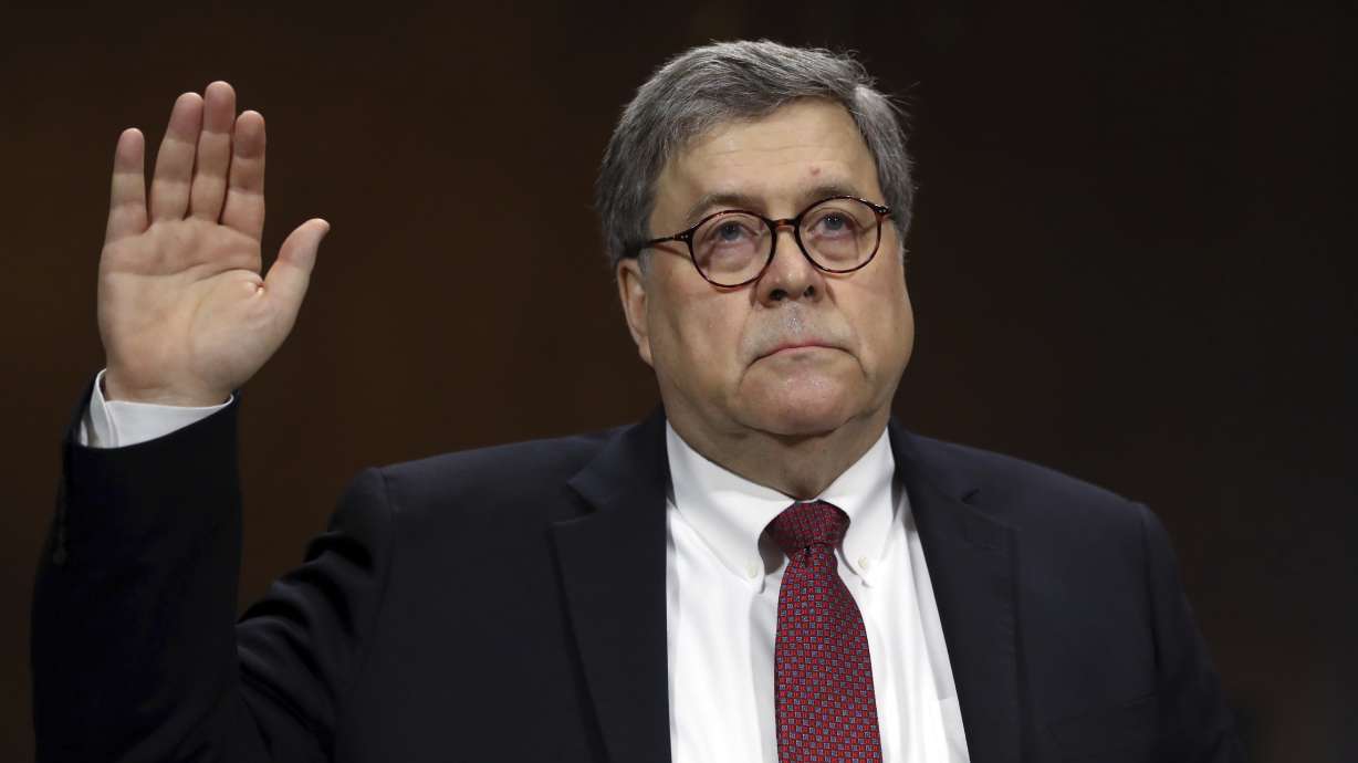 The Latest: House panel votes to hold AG Barr in contempt