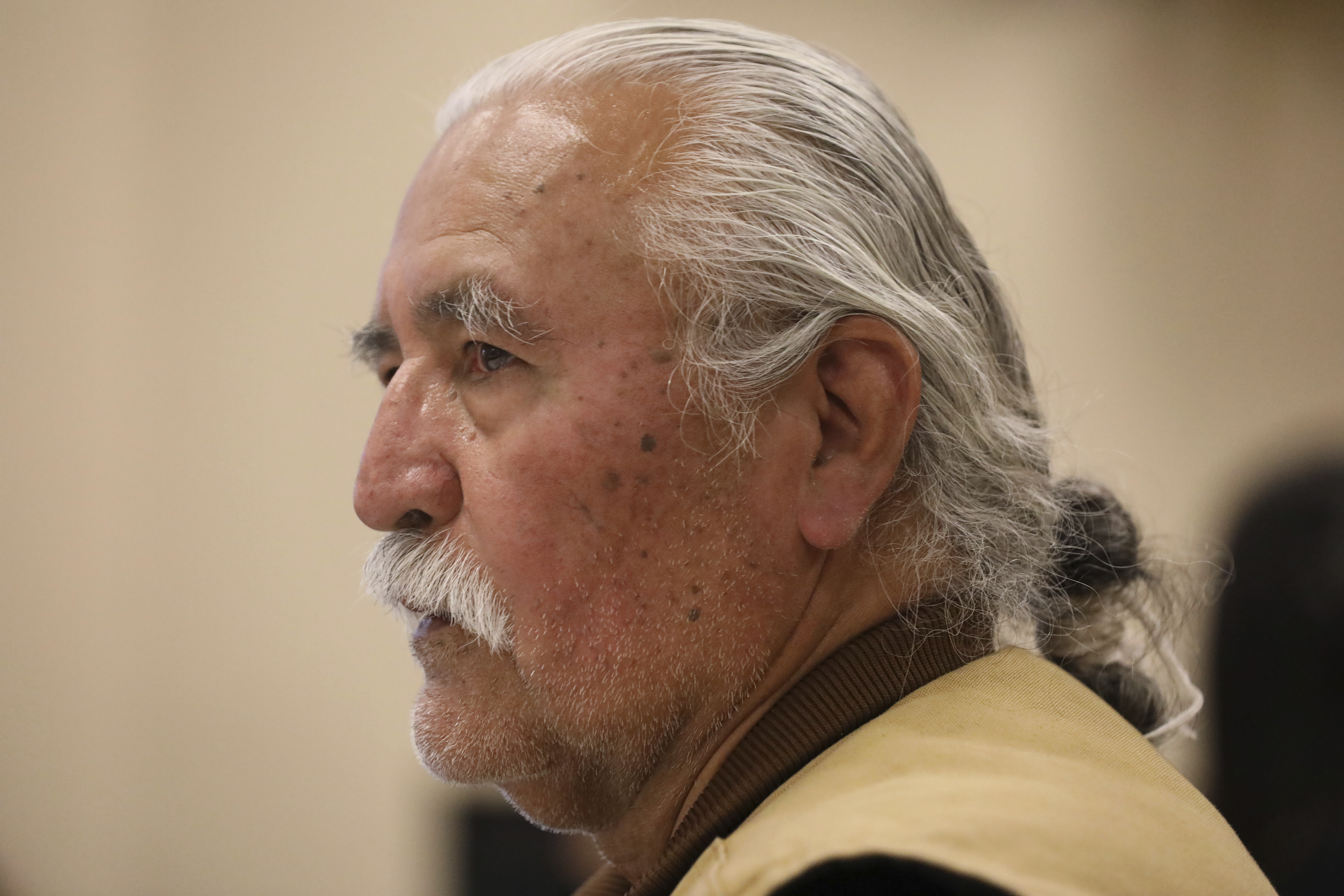 In this Oct. 24, 2018, photo, then-Democratic county commission candidate Willie Grayeyes speaks to a group in White Mesa, Utah. Grayeyes on Tuesday proposed the commission take action on hiring David Everitt as interim county administrator, which some say broke Utah open meetings law. (AP Photo/Rick Bowmer)