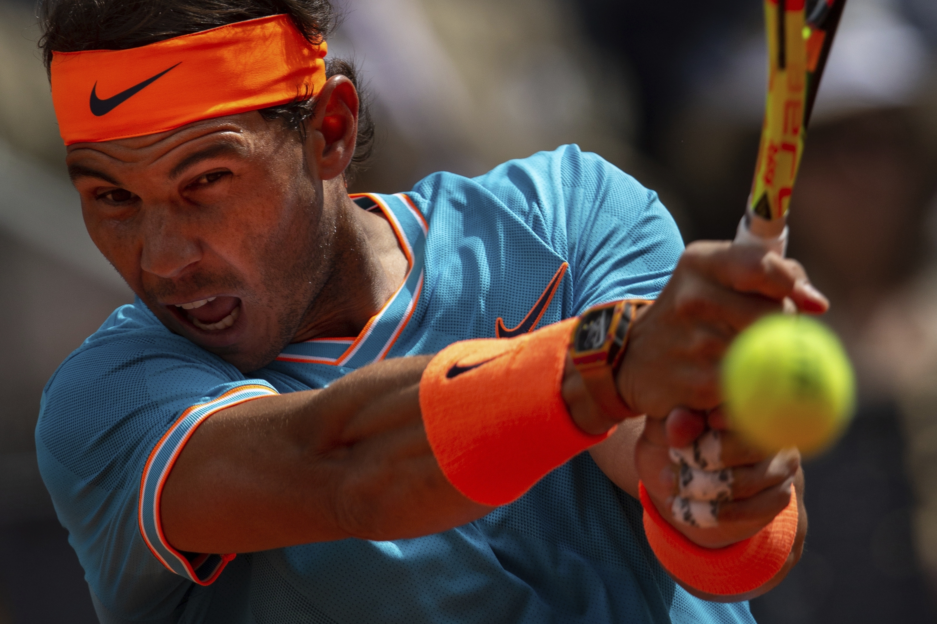 Nadal overcomes stomach virus to advance in Madrid Open