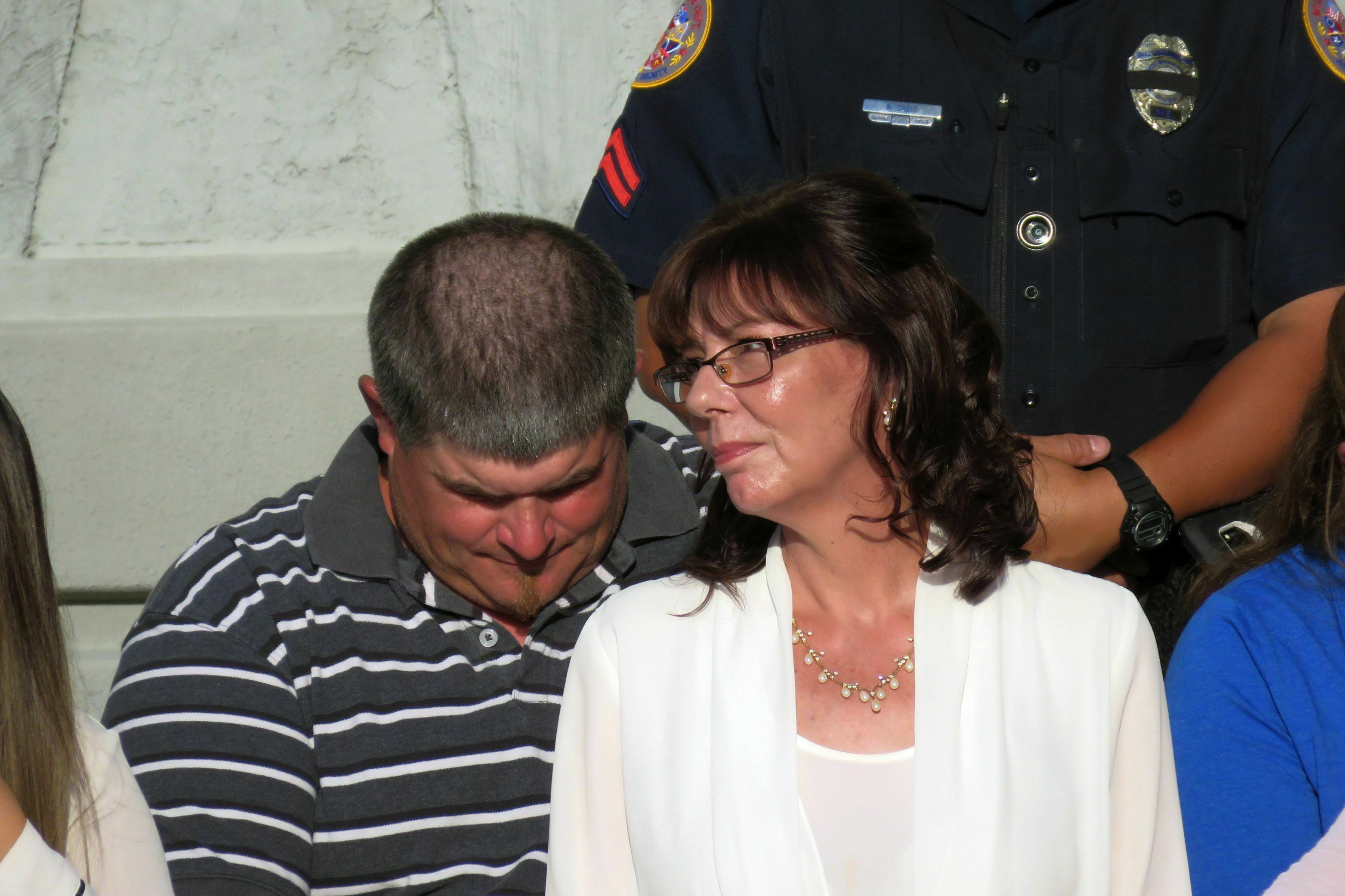 The Latest: Investigator: Slain officer was shot from behind