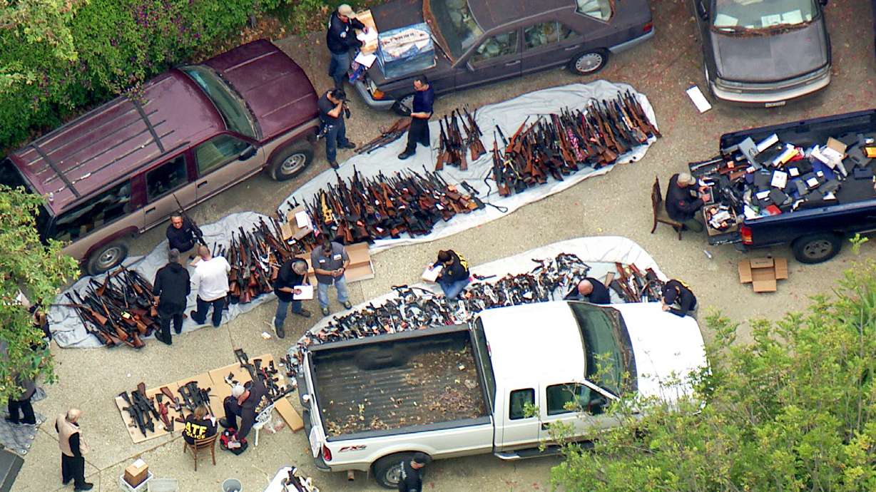 The Latest: Man arrested, 1,000 guns seized at LA mansion