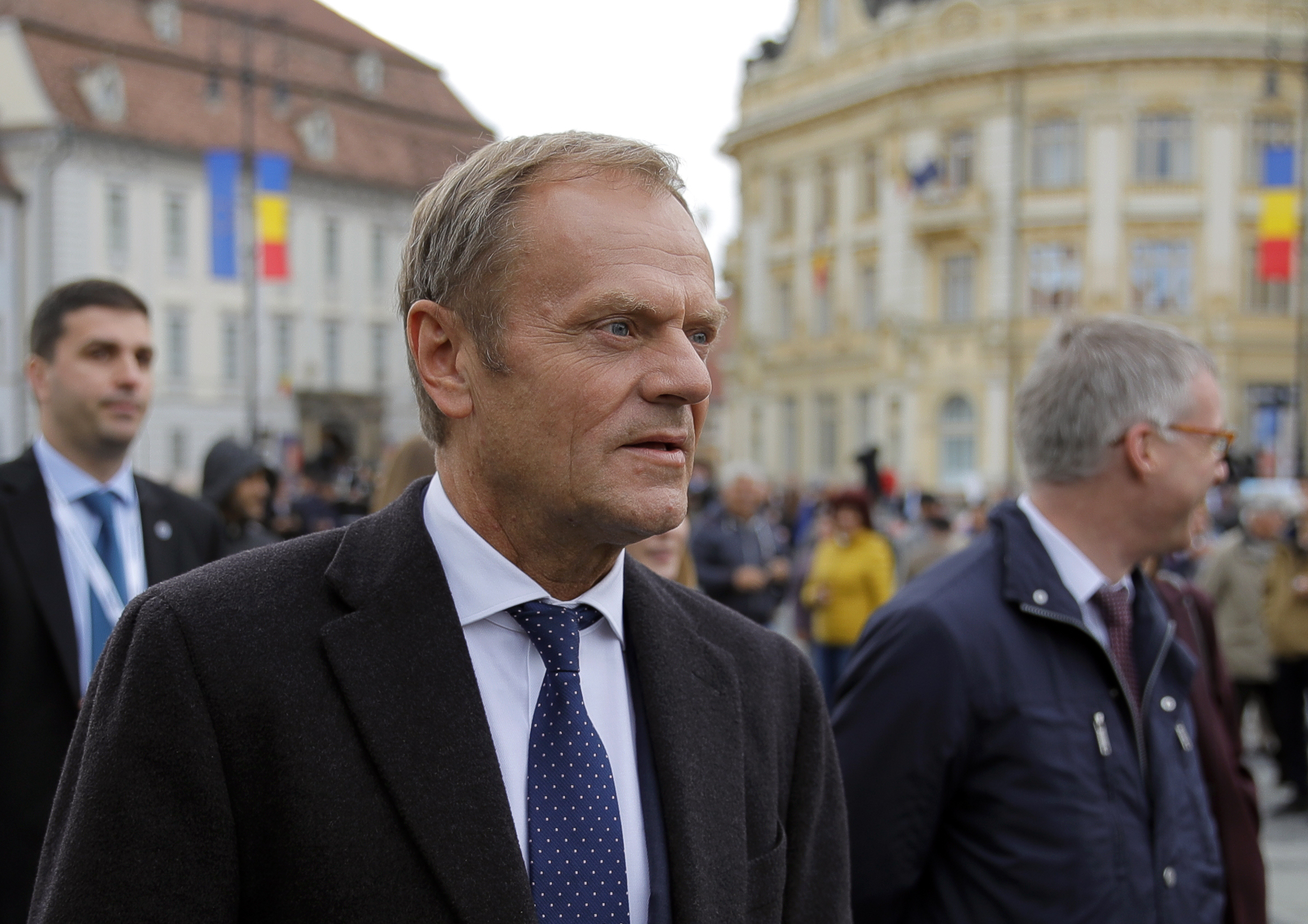 The Latest: Romanian soccer hero scores again for EU's Tusk