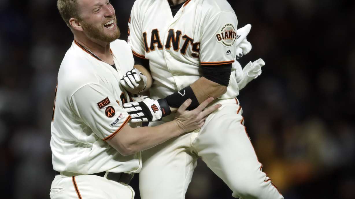 Giants' Posey on 7-day concussion list after hit in helmet