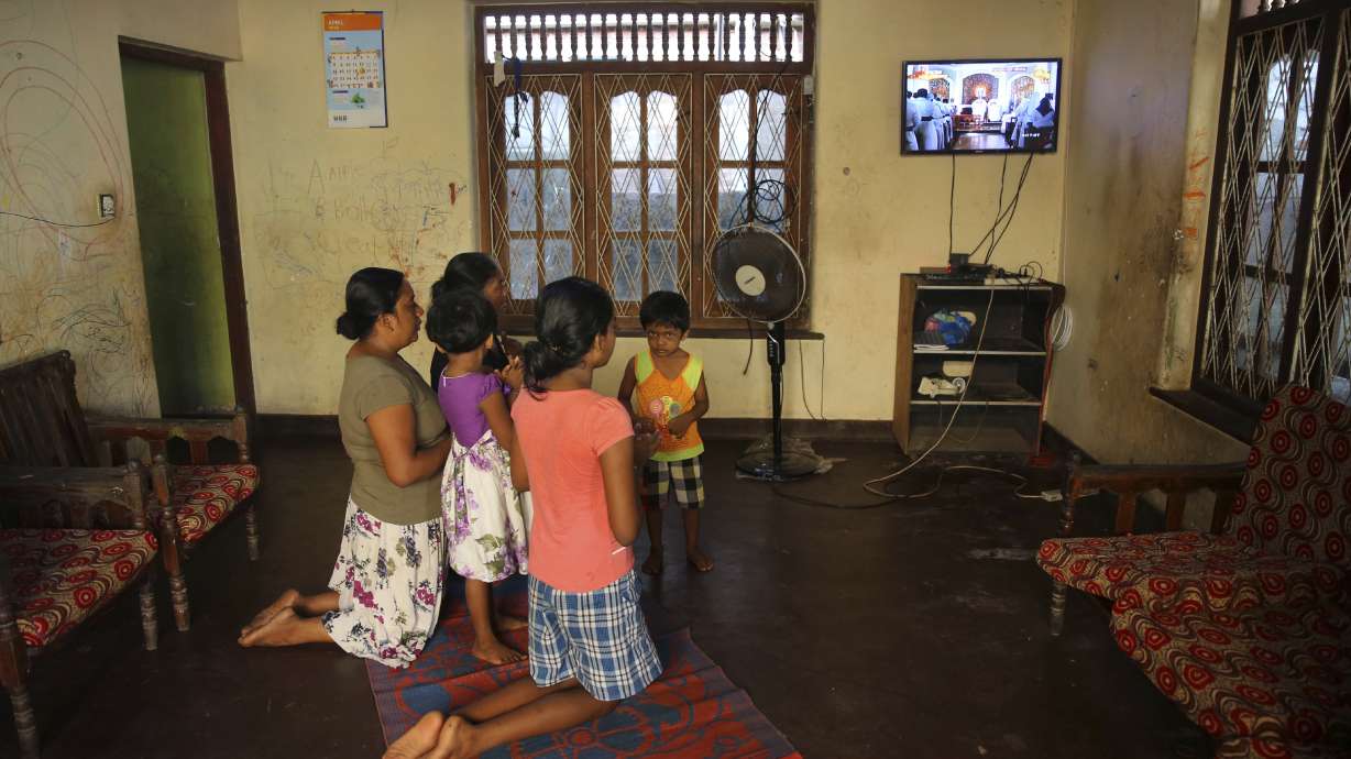 The Latest: Mass held at church where 100 died in bombing