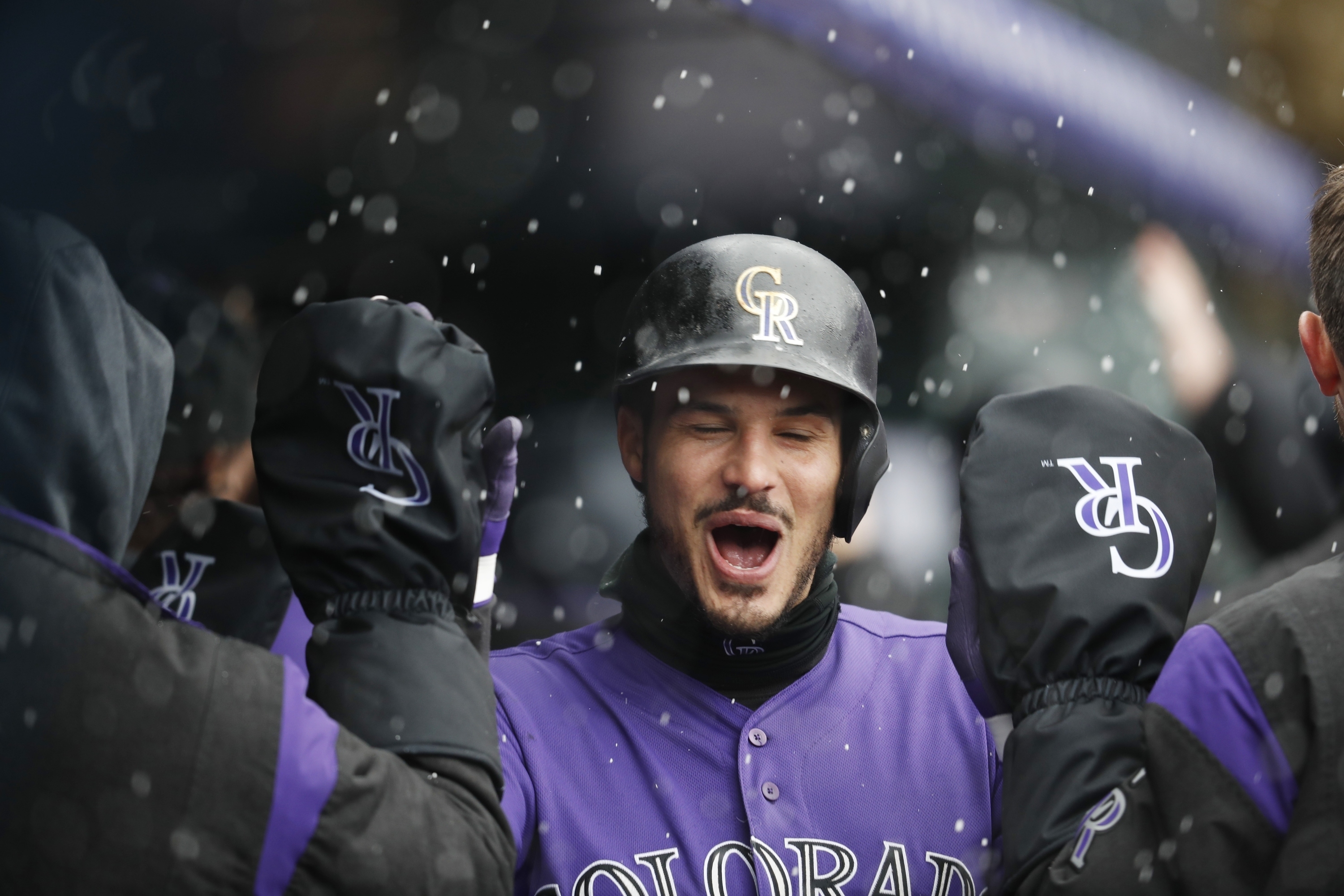 Arenado homers as Rockies outlast Giants, 12-11