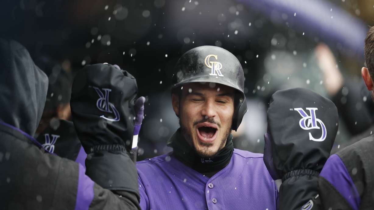 Arenado homers as Rockies outlast Giants, 12-11