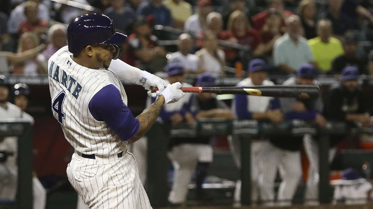 Peralta, Marte lift Diamondbacks over Braves 3-2 in 10