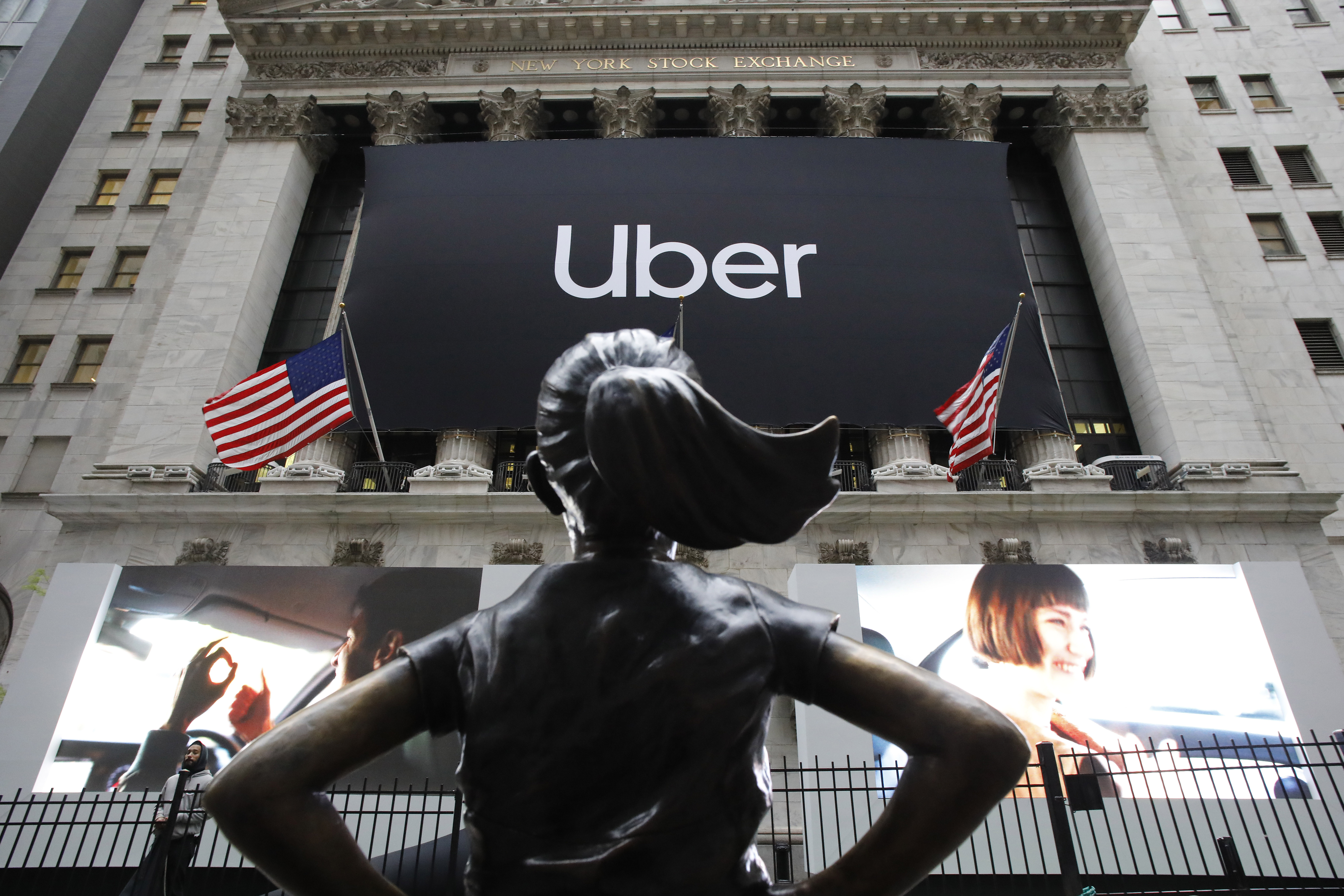 The Latest: Uber stock slides almost 8% on rocky first day